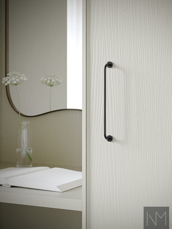 Fronts for wardrobes in Enigma design. Ash painted in color Jotun 1973 Antikkgrå. Handles Castle Max black matte.