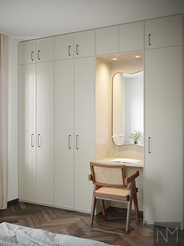 Wardrobe doors in Enigma design. Ash painted in color Jotun 1973 Antikkgrå. Handles Castle Max black matte.