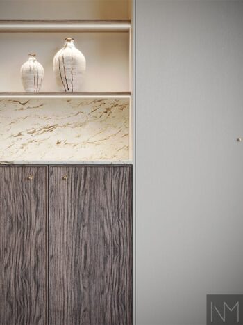 Frameline storage fronts in ash. B-1267 and F&B Skimming Stone no.241. Handles Toggle in untreated brushed brass.
