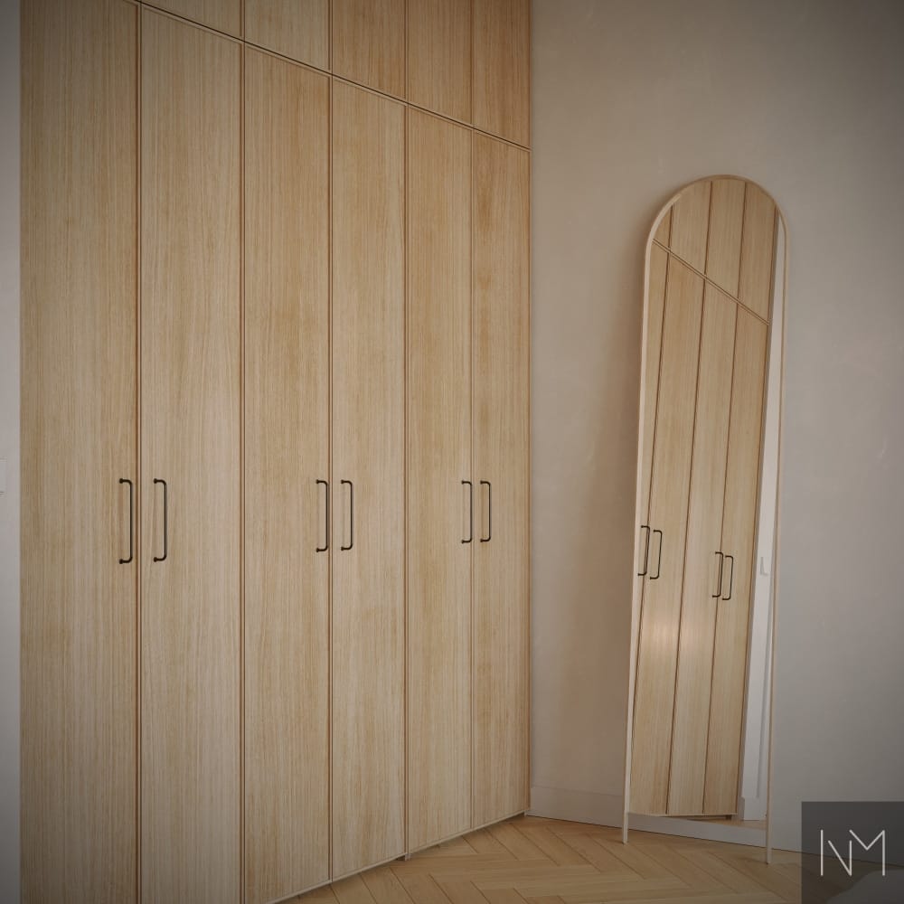 Frameline wardrobe doors in clear coated oak and Castle Max handle in matte black.