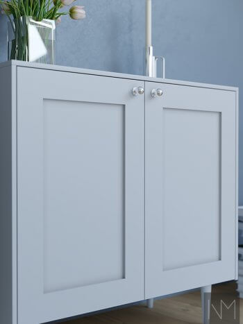 white cupboards with flowers ontop