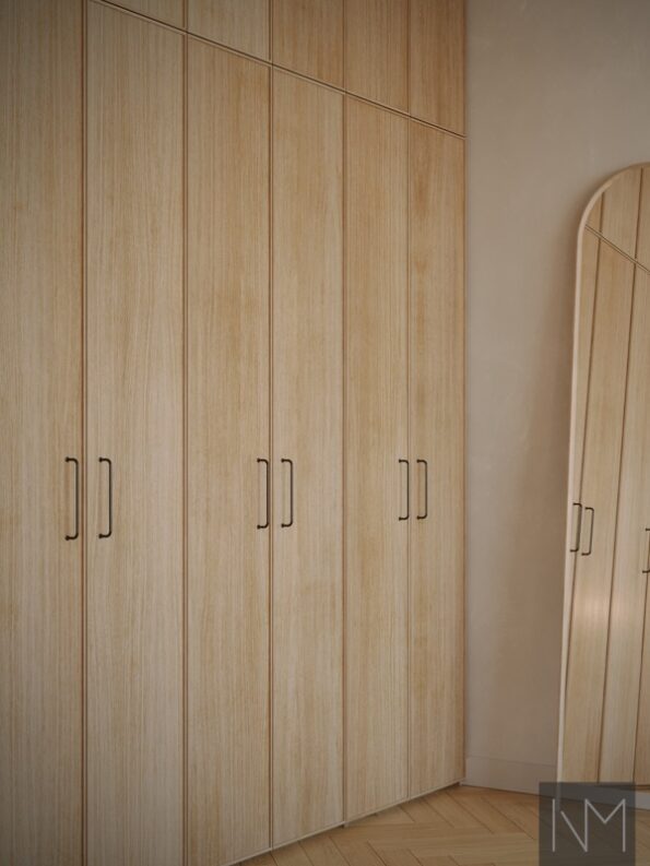 Frameline wardrobe doors in clear coated oak and Castle Max handle in matte black